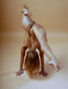 Nude gymnast does the gymnastic exercises
